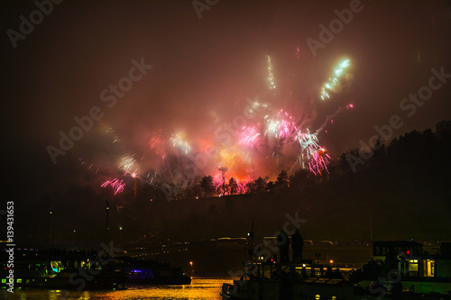 Big dramatic fireworks scene with green clouds and red fire