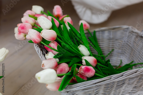 Fototapeta Naklejka Na Ścianę i Meble -  Beautiful spring flowers tulips in the buckets on city street
