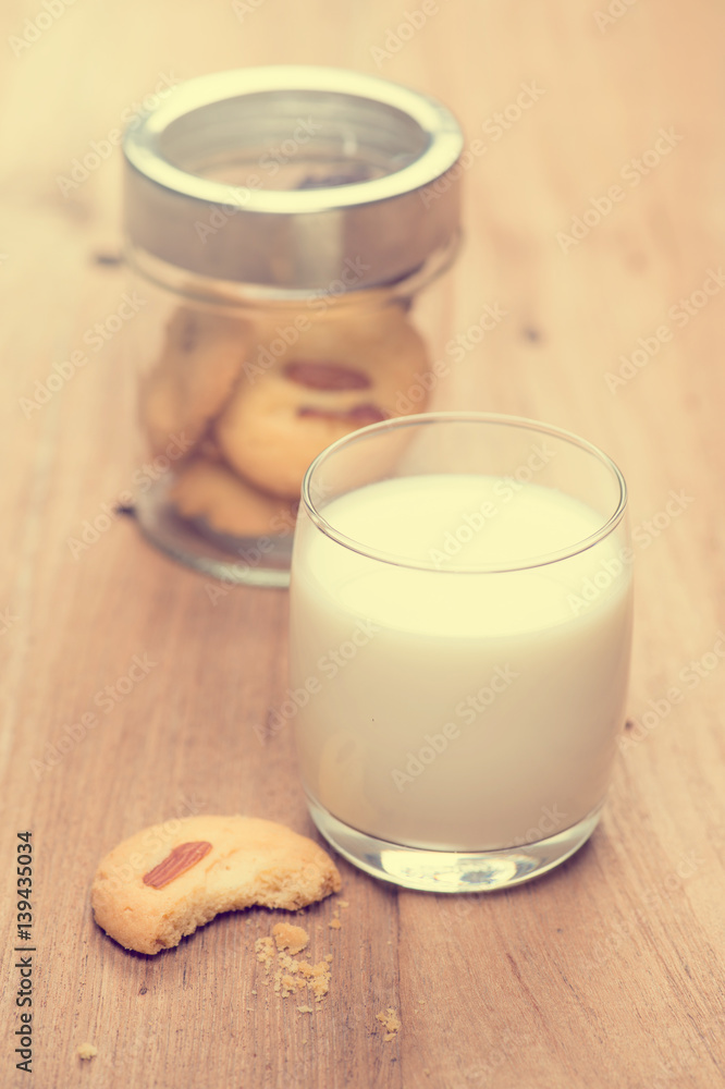 cup of milk wite cookies on wood table cup of milk wite cookies on wood table