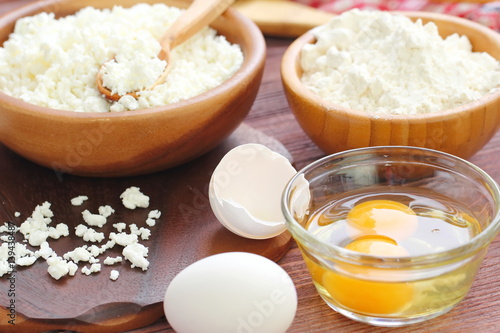 Ingredients for baking: cottage cheese, eggs and flour