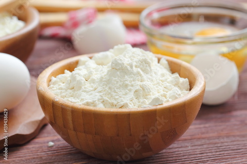 Ingredients for baking: cottage cheese, eggs and flour