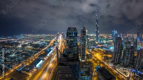 Wallpaper Mural Beautiful panoramic skyline of Dubai night timelapse, United Arab Emirates. View of world famous skyscrapers. Torontodigital.ca