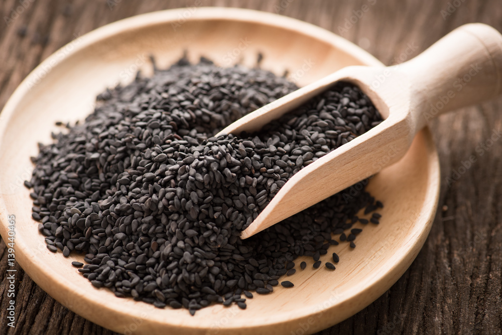 black Sesame close up shot on wood background black Sesame close up shot on wood background