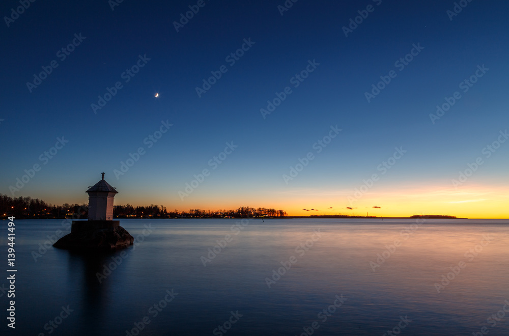 Small lighthouse at sunset