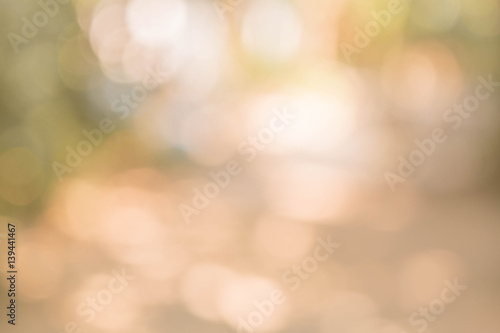 Abstract blurred circle bokeh in warm tone for Christmas or celebration light holiday background.