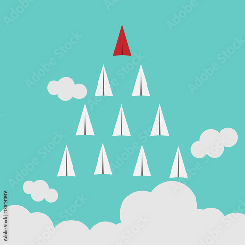 White and red paper planes flying in  blue sky. Leadership, success, teamwork, management, boss, motivation and business concept.