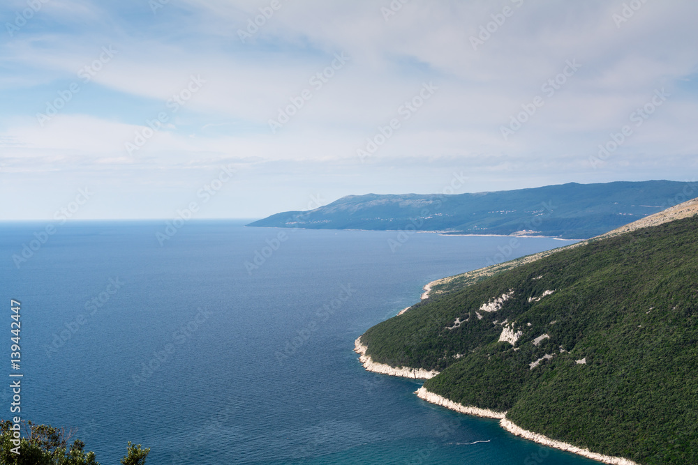 High aerial view to sea bay, peninsula and mountain in Opatija. Croatian seascape with lagoon and hiils.