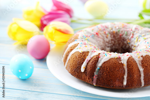 Wallpaper Mural Easter eggs with cake on a blue wooden table Torontodigital.ca