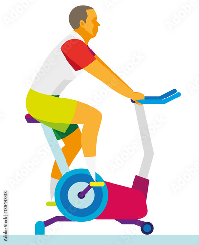 young man is training on a exercise bike in the fitness center