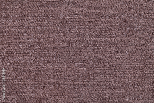 Brown fluffy background of soft, fleecy cloth. Texture of textile closeup