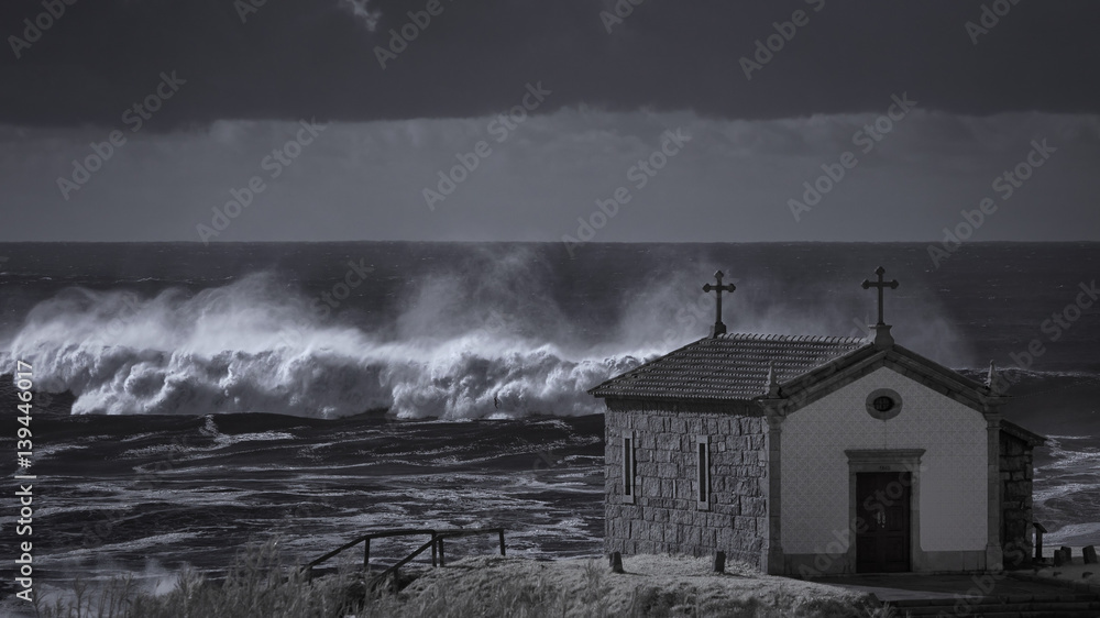 Chapel near stormy sea