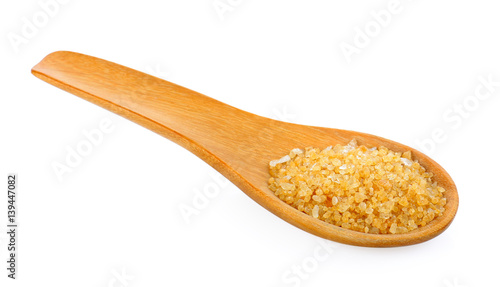 Sugar for coffee in wood spoon on white background