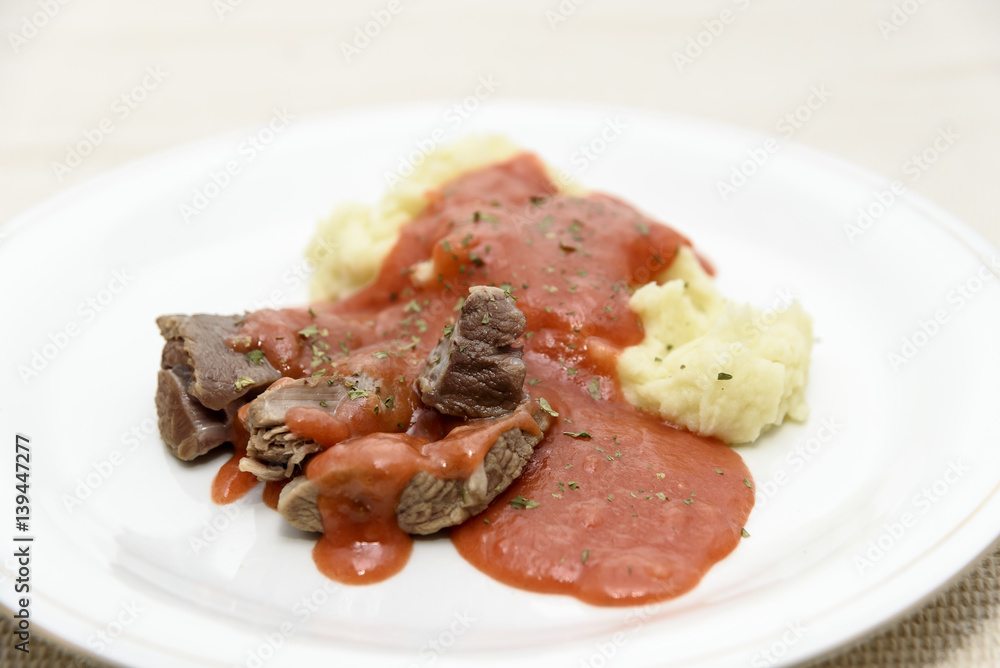 Homemade tomato sauce with mashed potatoes and boiled beef Homemade tomato sauce with mashed potatoes and boiled beef