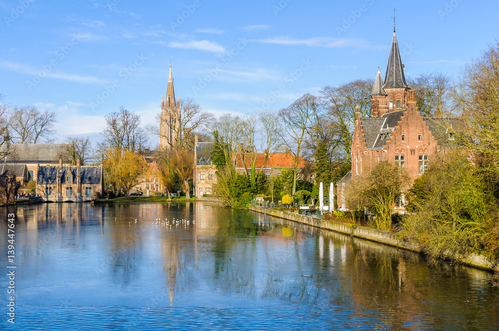 Reflection in the lake in Minnewater, Bruges, Belgium Reflection in the lake in Minnewater, Bruges, Belgium