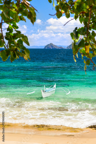 Banca boat at a beautiful beach in Cagnipa Island,Philippines photo