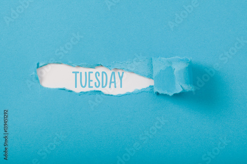 Tuesday, English weekday message on Paper torn ripped opening
