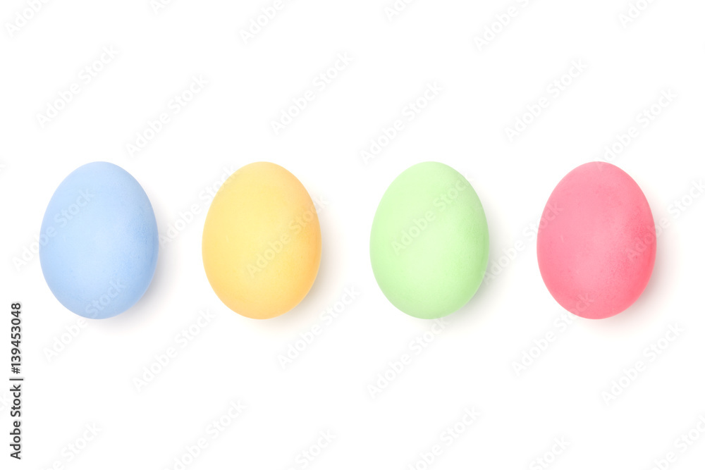 four colorful easter eggs isolated on white background without pattern on eggs shell