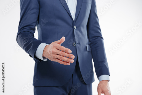 Cropped image of man extends the hand