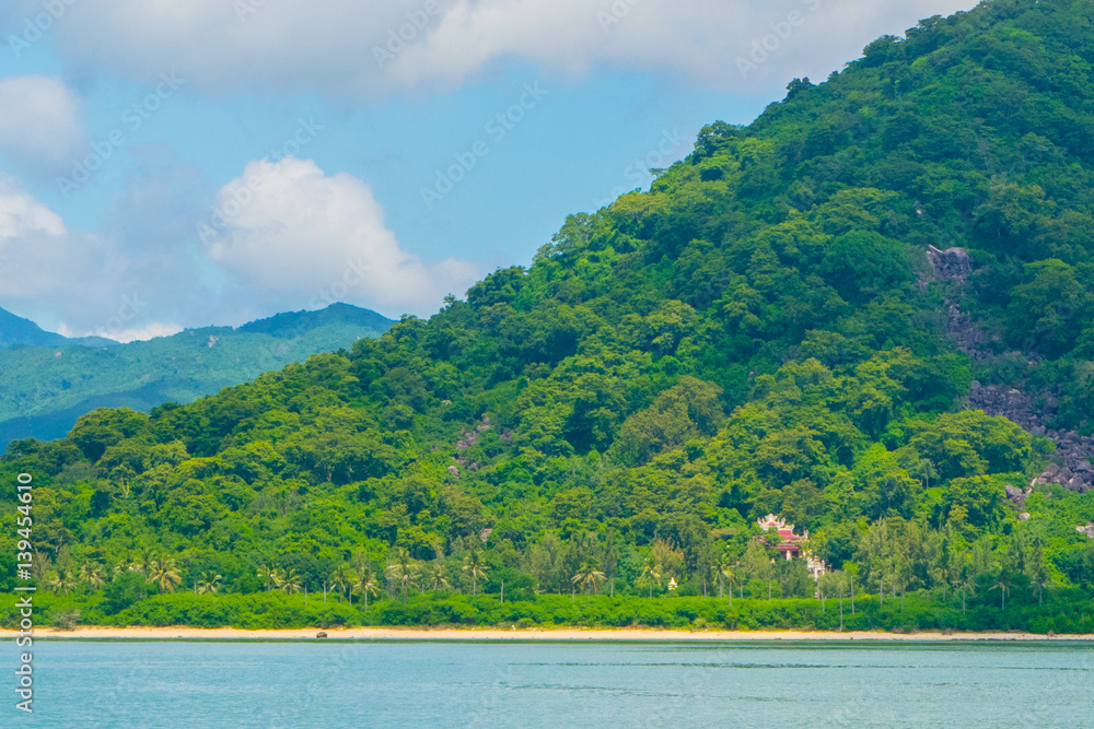 Stone sea shore at a paradise island -the South China sea - Vietnam Nha Trang bay