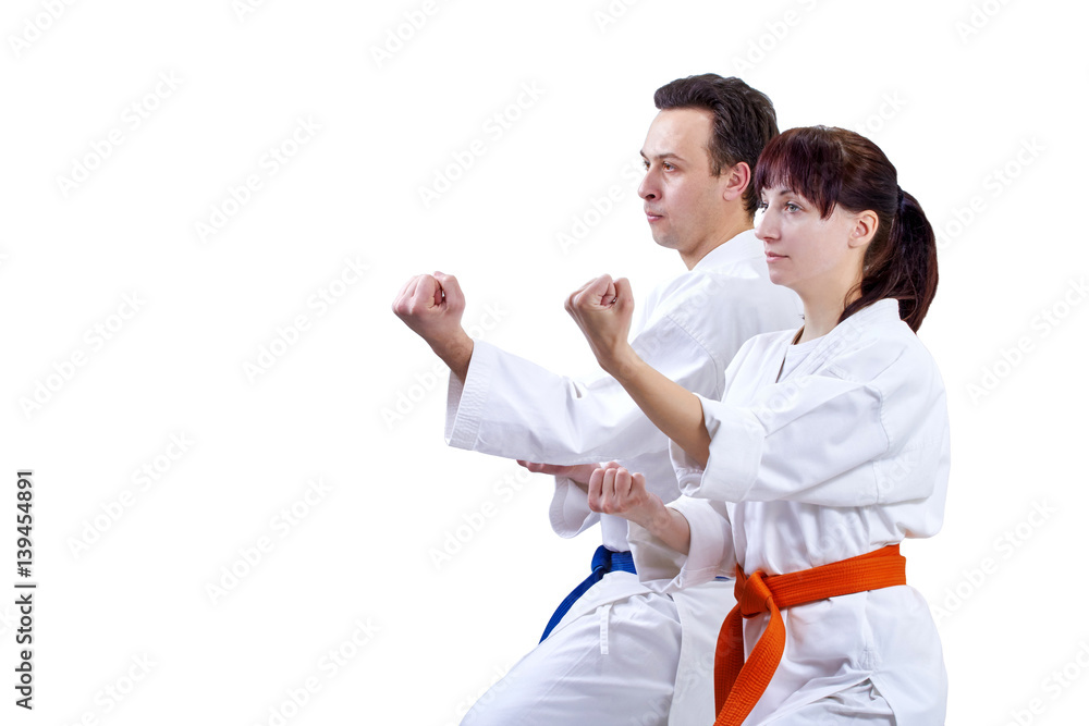 Two adult athlete standing in the rack karate Two adult athlete standing in the rack karate