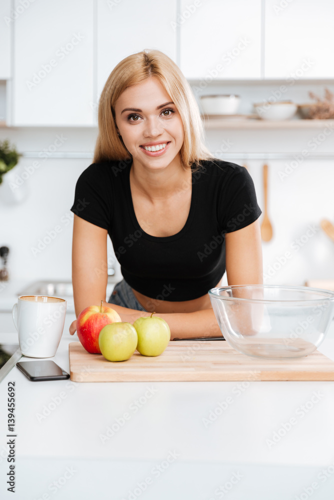 Vertical image of woman in kitchen