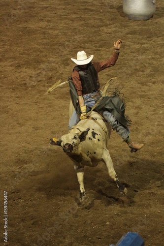 Rodeo cowboys clowns flags and fences
