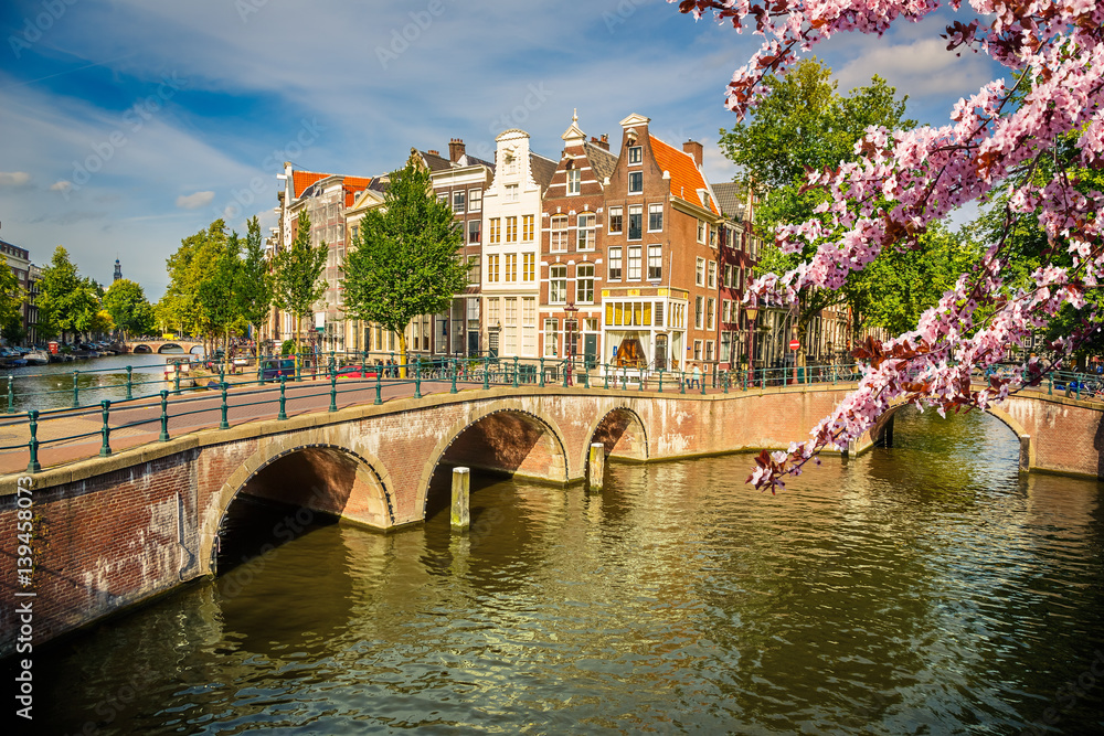 Naklejka premium Bridges over canals in Amsterdam at spring