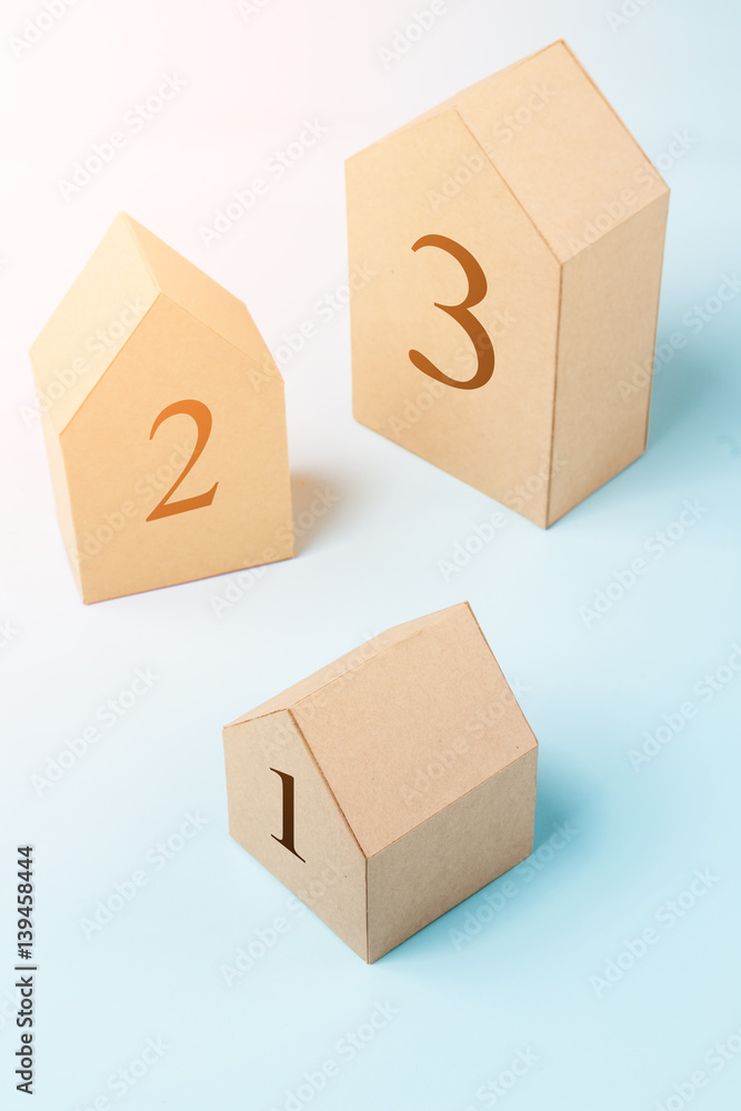 Obraz premium three house model cardboard with free copyspace house loan business concept