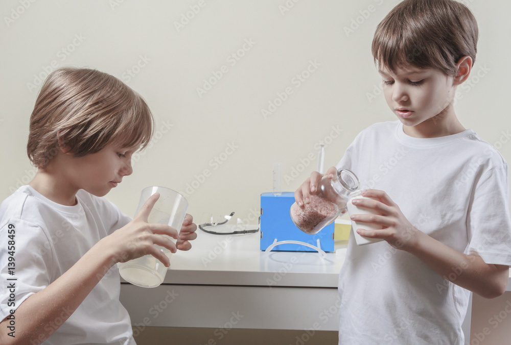 Boys doing science experiments. Education concept.