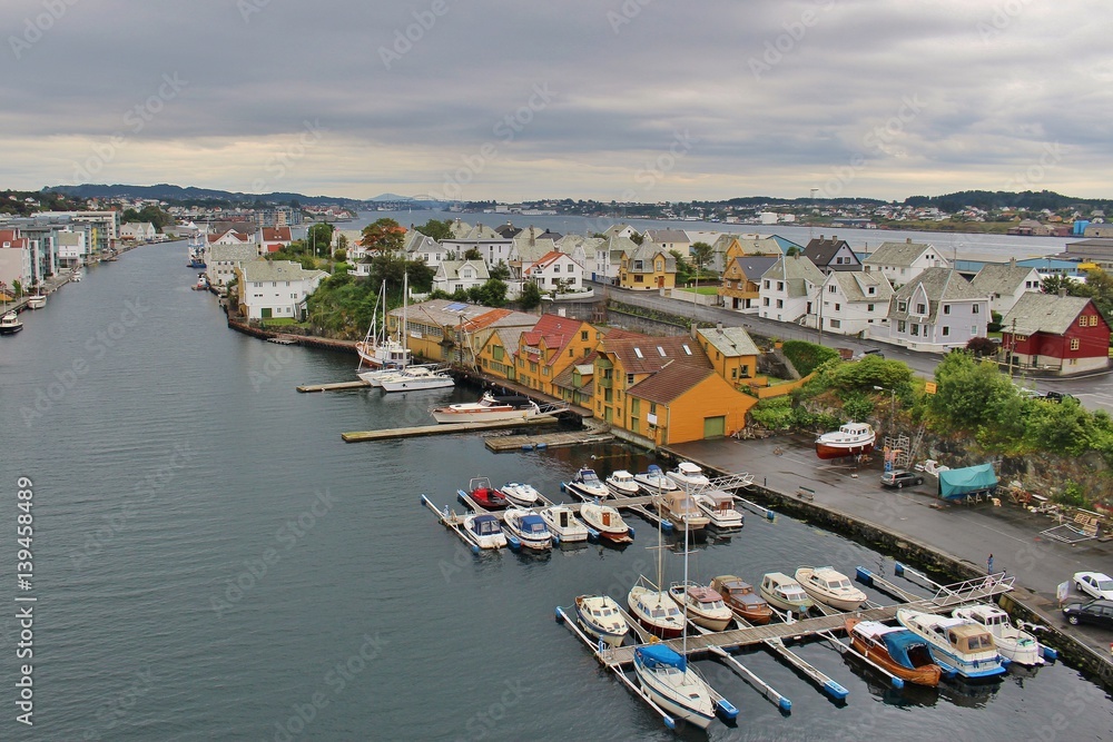 Panoramic view of the strait Smedasund in Haugesund. On the right historic herring export buildings (orange). Norway, Scandinavia, Europe.
