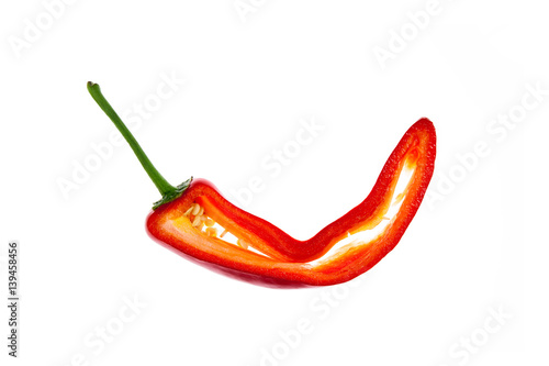 Cut into half red chilly pepper on white background