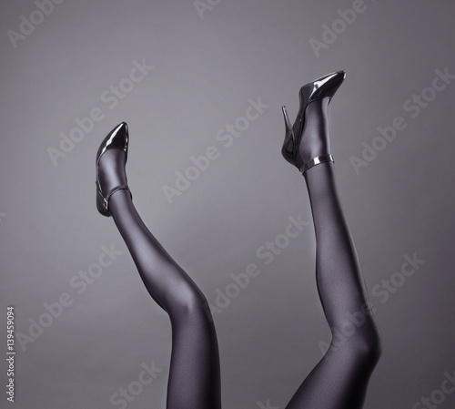 Woman's Legs Wearing Spandex Pantyhose and High Heels