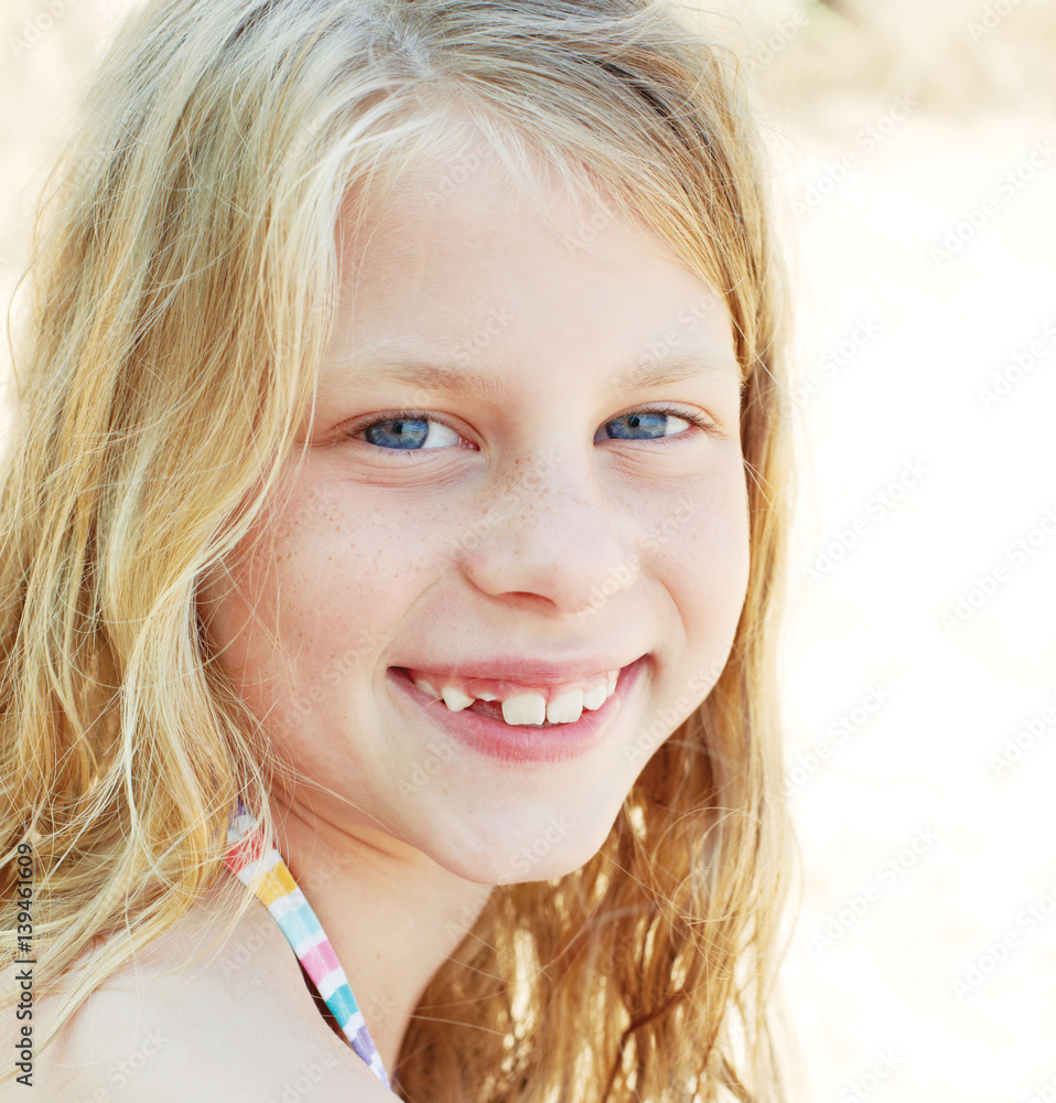 Portrait of a girl with curly hair and blue eyes Stock Photo | Adobe Stock