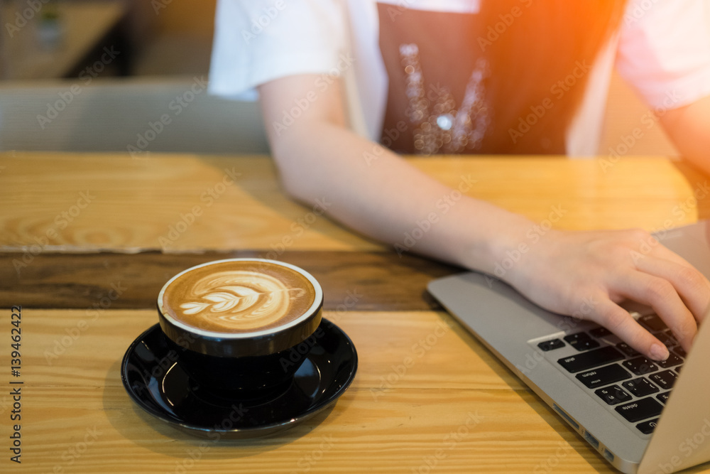Woman using computer laptop in coffee shop Woman using computer laptop in coffee shop