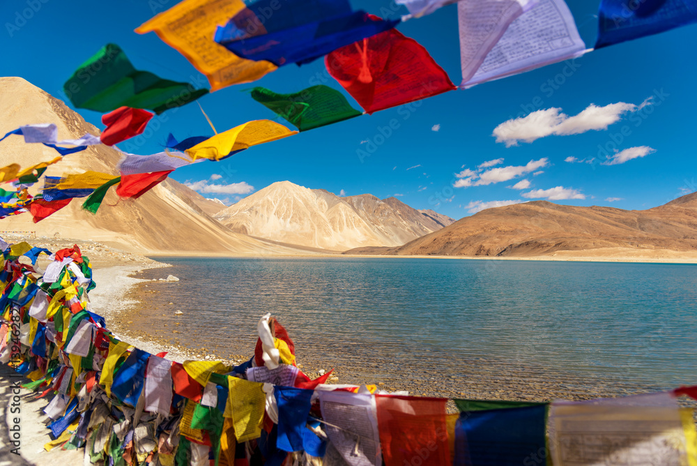 Naklejka premium Mountains and Pangong tso (Lake). It is huge and highest lake in Ladakh and blue sky in background,