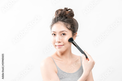 Beauty Asian Girl with Cosmetics Makeup.