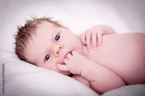 Portrait of baby laying on back