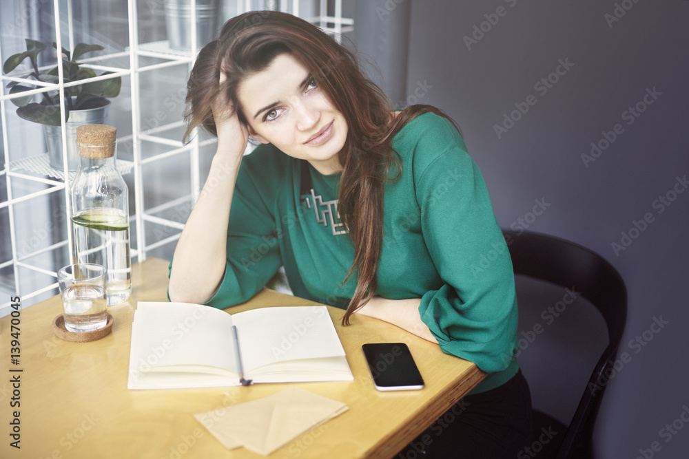 Beautiful young caucasian woman around thirty sitting happy in cafe, having breakfast, drink pure water Beautiful young caucasian woman around thirty sitting happy in cafe, having breakfast, drink pure water