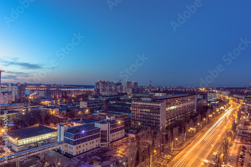 Night Voronezh city after sunset, blue hour, night lights of houses, buildings, 