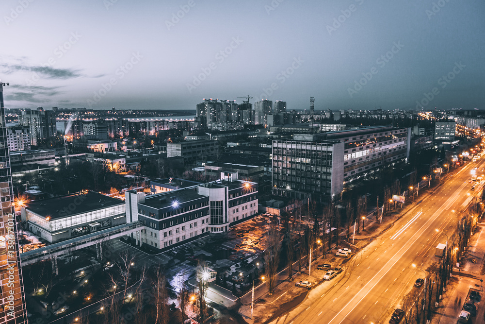 Fototapeta premium Urban landscape, Voronezh city in dramatic moody tones and cold colours, night 