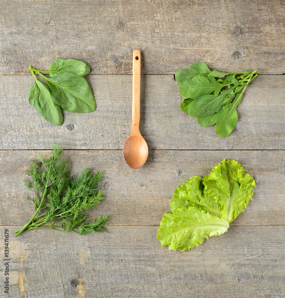Organic food. wooden spoon, ingredients for saladon on old, rustic, wooden table. top view Organic food. wooden spoon, ingredients for saladon on old, rustic, wooden table. top view