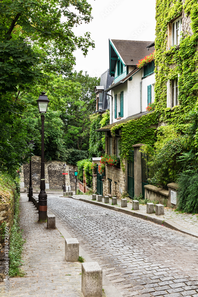 Charming old street of Montmartre hill. Paris, France