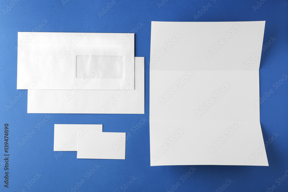 Blank brochure, envelope and card on blue background Blank brochure, envelope and card on blue background