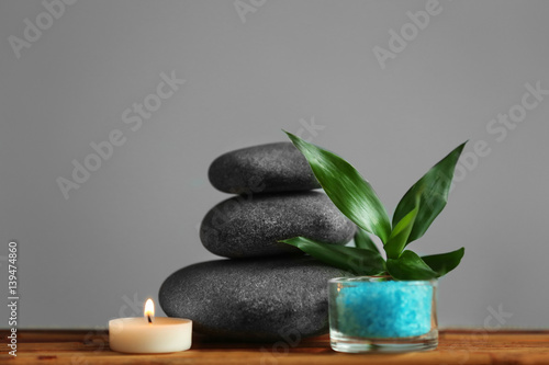 Beautiful spa composition on bamboo mat against grey background
