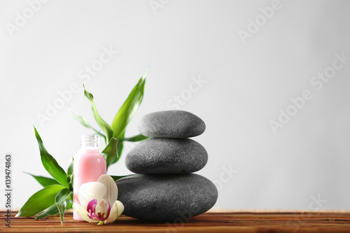 Beautiful spa composition on bamboo mat against light background