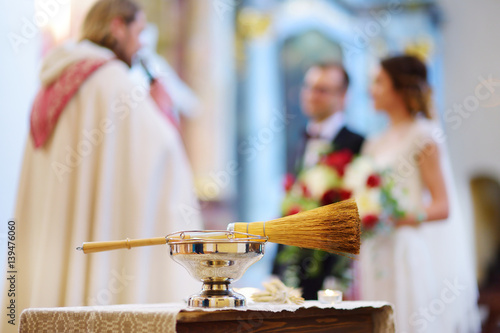 Priest's wedding accessories during wedding ceremony in a church