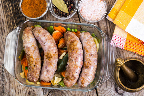 Country sausage with vegetables baked in the shape of glass