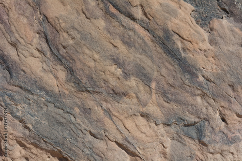 Textured surface of colorful rock