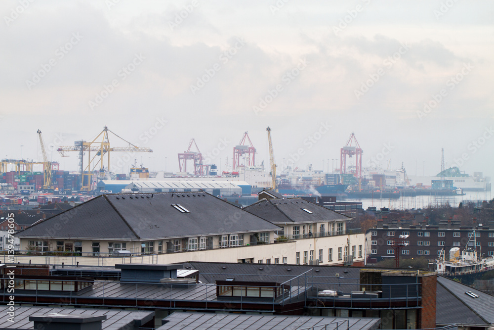 DUBLIN - DECEMBER 12: View of foggy day at winter start over the port and industrial parts of in Dublin, Ireland, December 12th, 2016 DUBLIN - DECEMBER 12: View of foggy day at winter start over the port and industrial parts of in Dublin, Ireland, December 12th, 2016