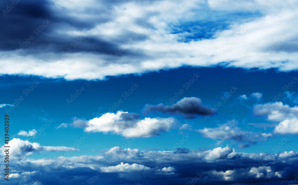 Beautiful blue background of a blue sky with different clouds Beautiful blue background of a blue sky with different clouds